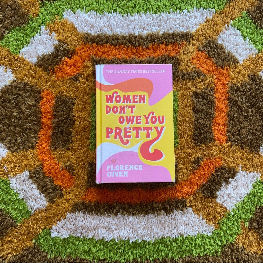 Hardcover book “Women don’t owe you pretty” by Florence Given